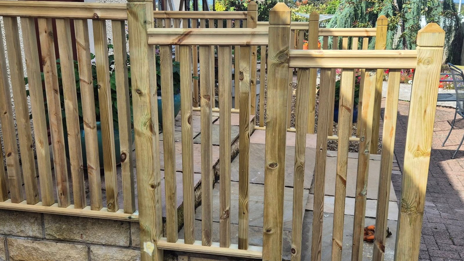 Timber decking with spindle balustrade and newel posts